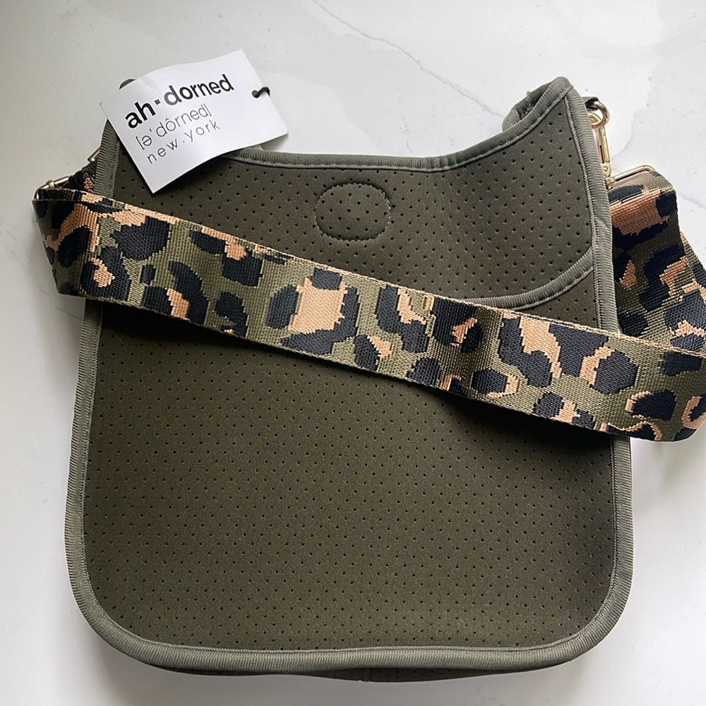 Green crossbody bag with camouflage strap; new with tag